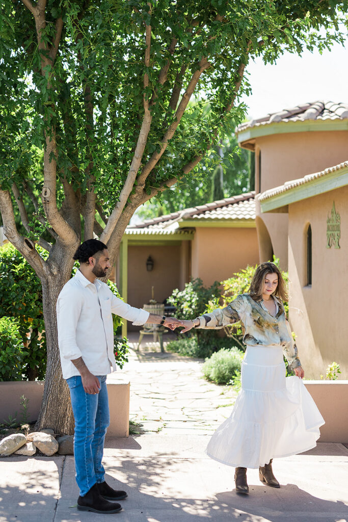 bride and groom dancing outside vineyard