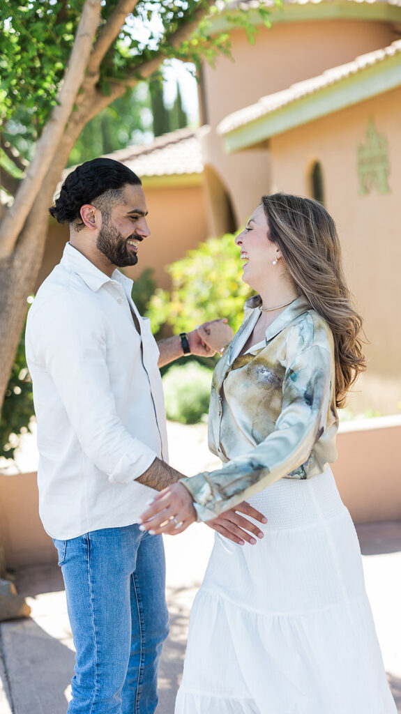 bride and groom facing one another with smiles