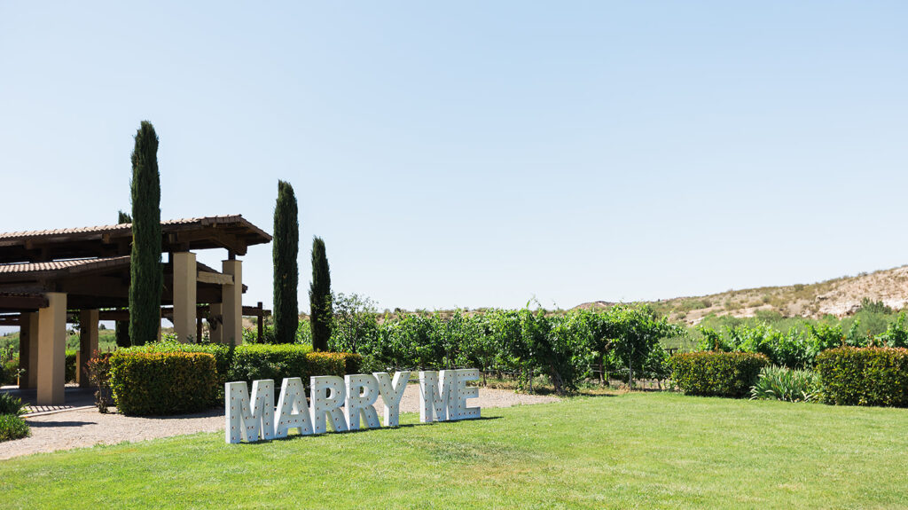 marry me marquee on vineyard grass