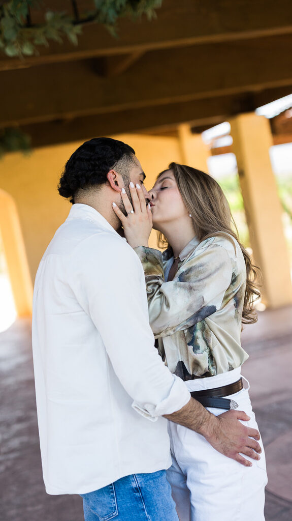 bride grabbing groom for a kiss