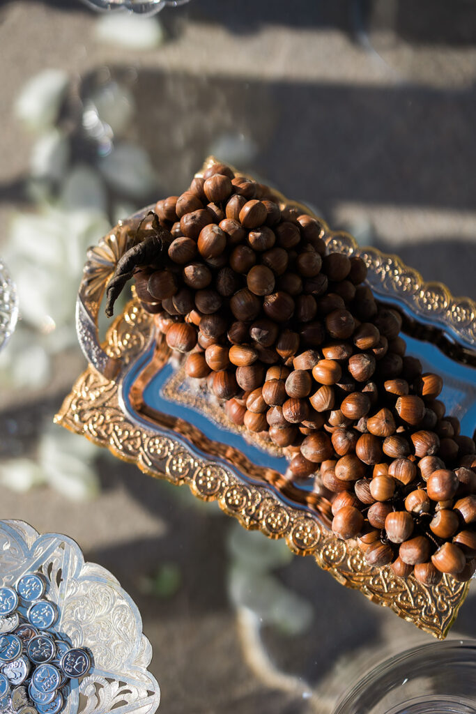 Elegant sofreh aghd with sweets and mirror.