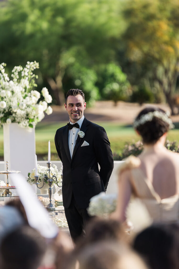 Groom greets bride at the aisle during mountain shadows wedding