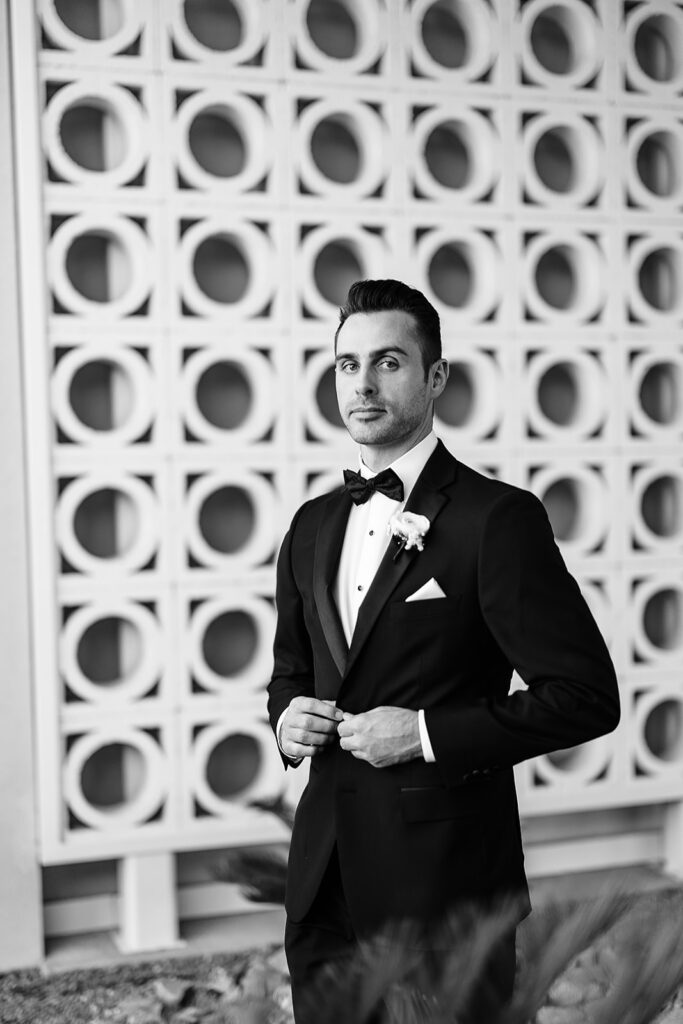 Black and white image of groom in suit