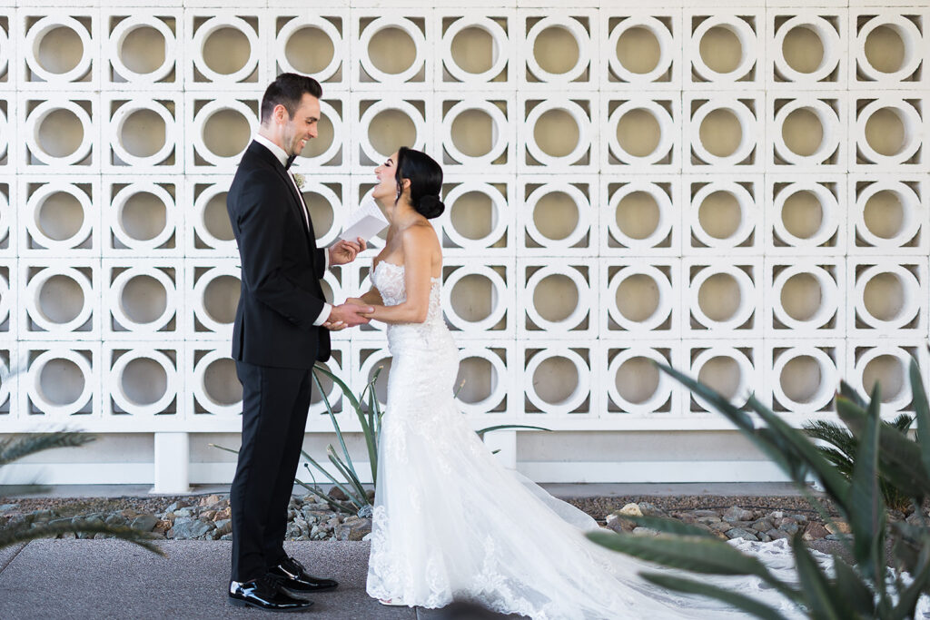 bride and groom exchange vows during first look at mountain shadows