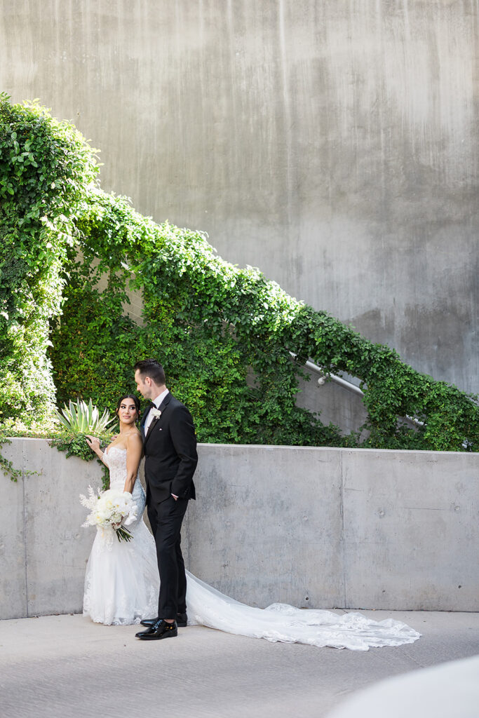Wedding couple holding hands at Mountain Shadows Resort.