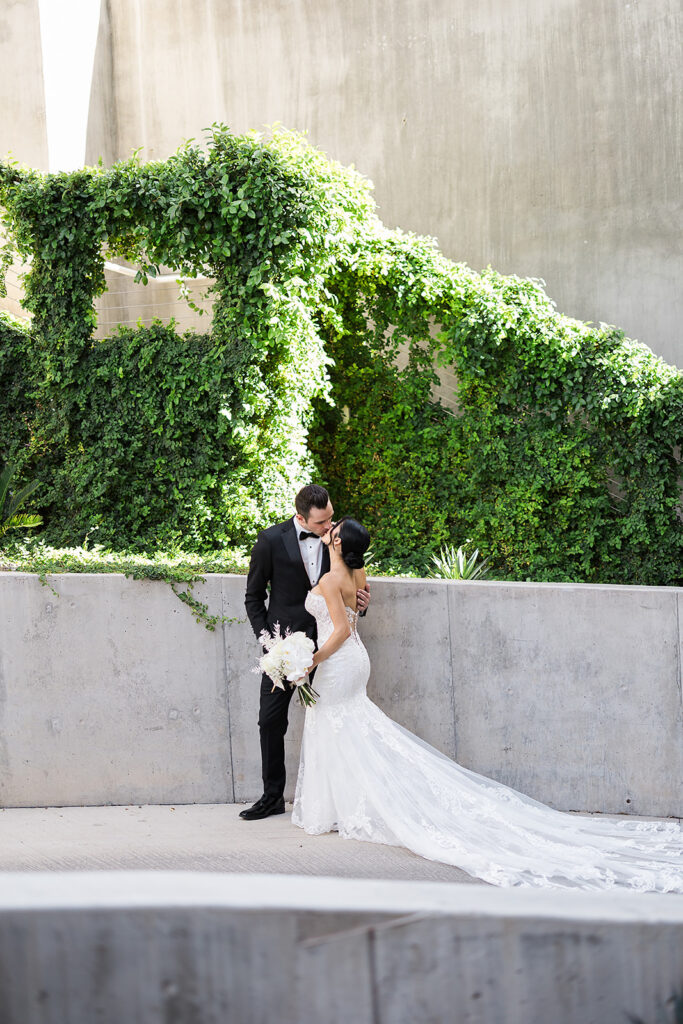Wedding couple kissing at Mountain Shadows Resort.